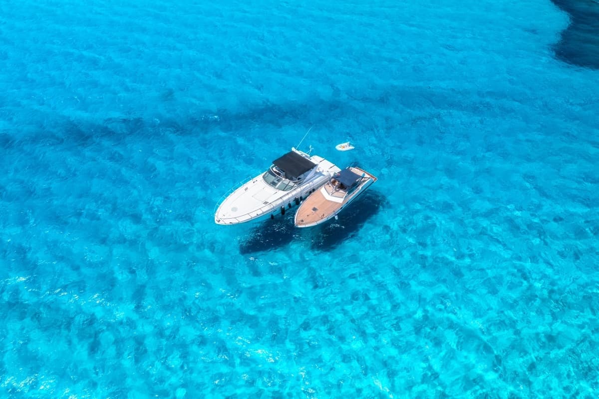 aerial-view-of-luxury-yachts-and-boats-on-blue-sea-2023-08-23-05-53-01-utc.jpg
